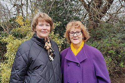 Lib Dem candidates for Streham, Caroline Shepherd and Pauline Wilson half body shot, stood in front of trees