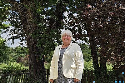 Charlotte Cane MP stood outside
