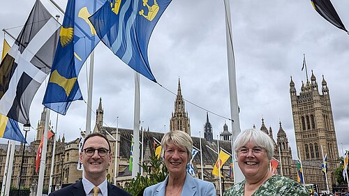 Cambridgeshire MPs Ian Sollom, Pippa Heylings and Charlotte Cane with Flags