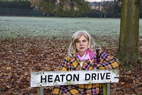 Alison Whelan wih 'Heaton Drive' Street Sign